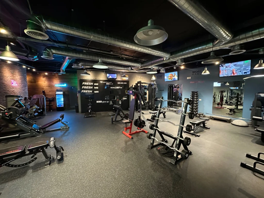 Spacious workout area with advanced fitness machines at Yamuna Fitness Hub